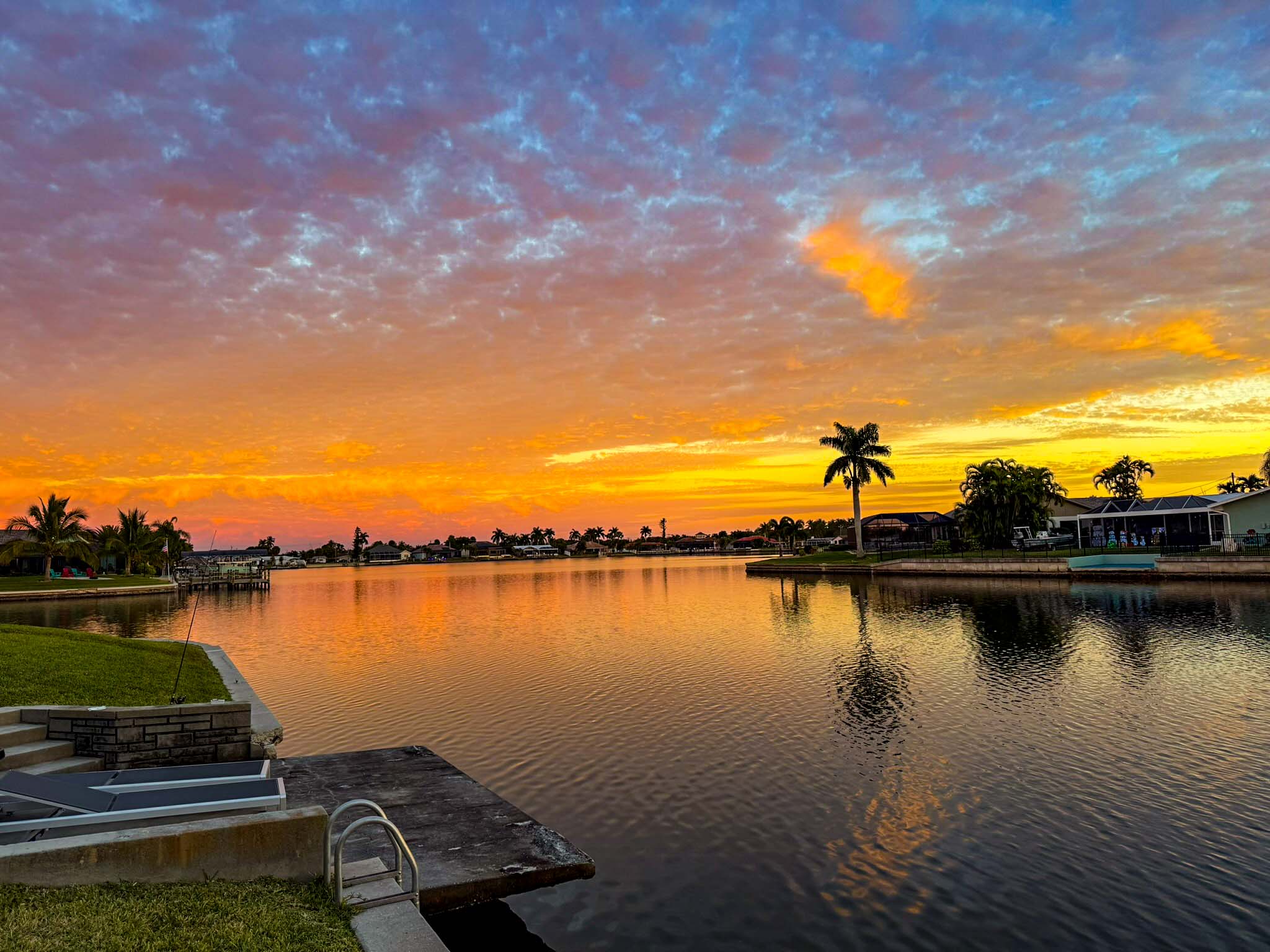 Sunset over a canal in Cape Coral, Florida